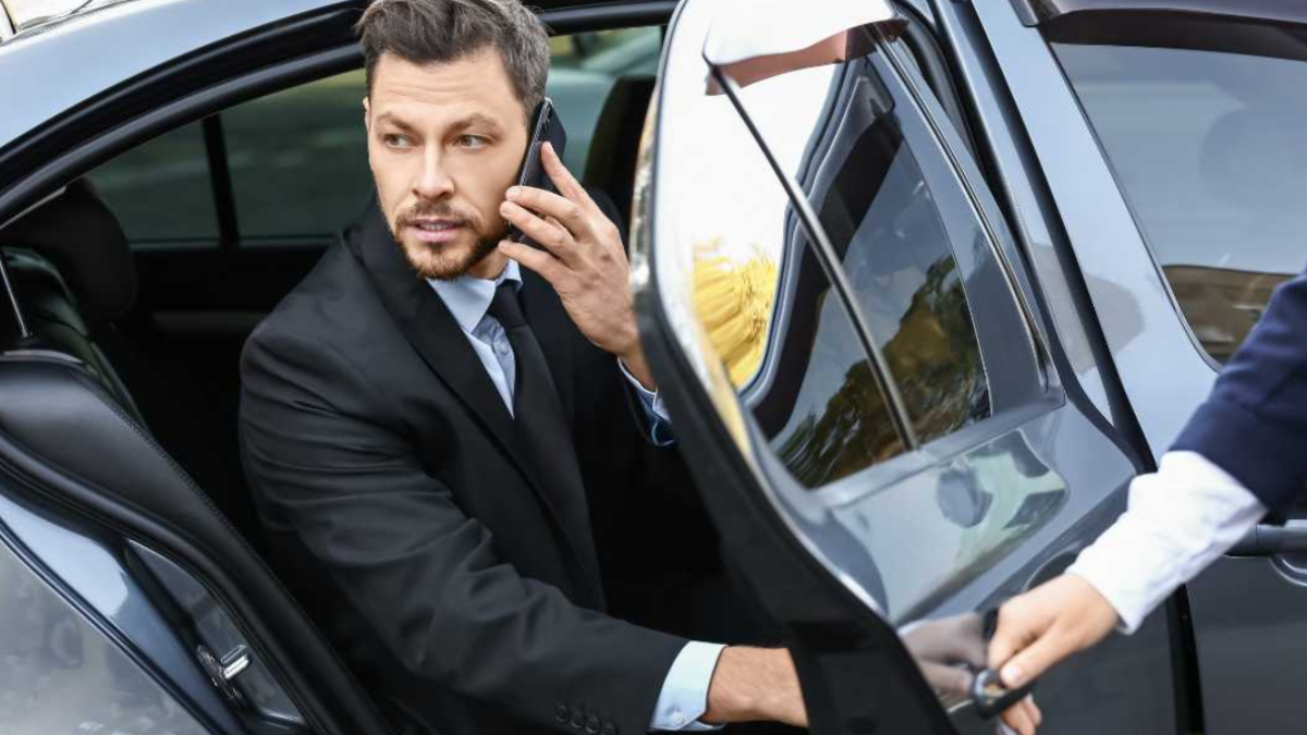 Luxury black car providing airport transportation to Boston Logan Airport